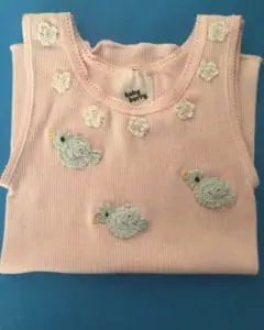 Crochet baby singlet with flowers and birds, portrait