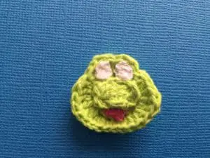 Crochet frog face with mouth and eyes