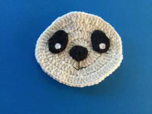 Crochet panda head with eyes