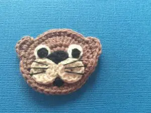 Crochet sea otter face with whiskers