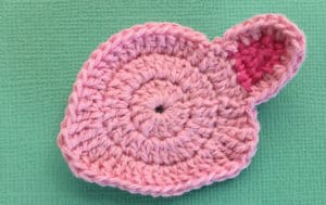 Crochet pig with finished first ear