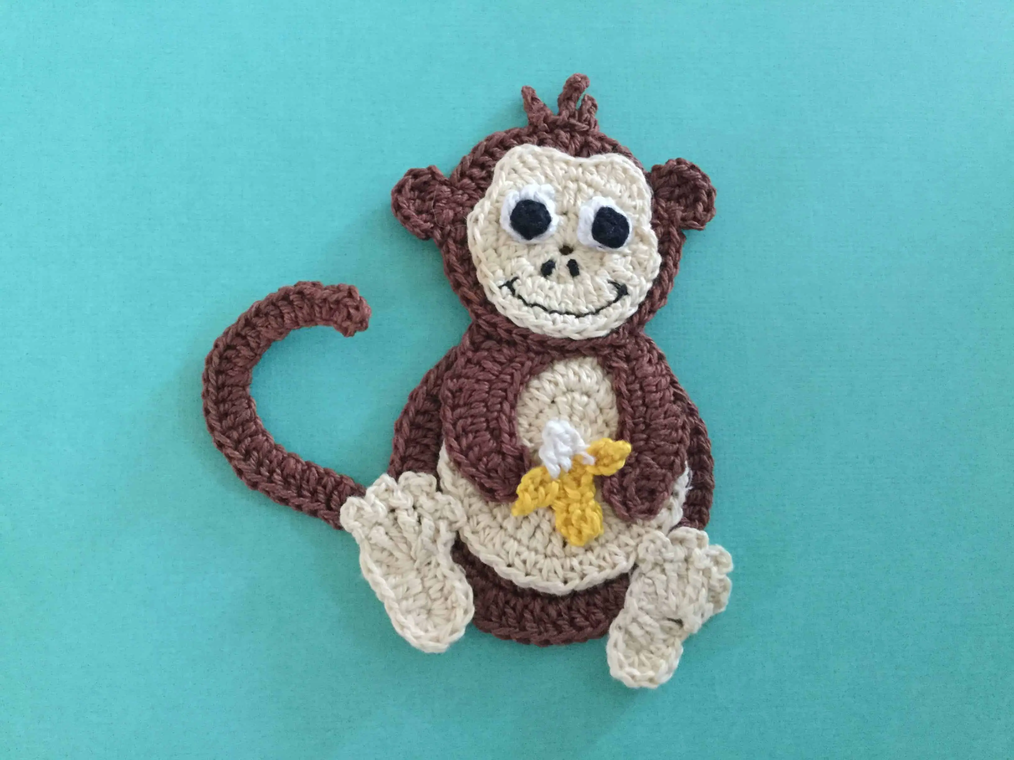 Finished crochet monkey with hair landscape