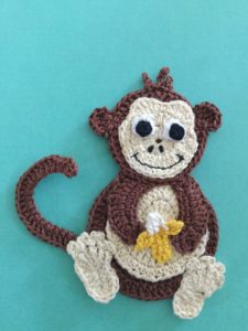 Finished crochet monkey with hair portrait