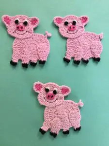 Finished crochet pig group portrait