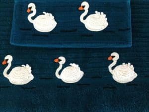 Finished crochet swan towel and face washer