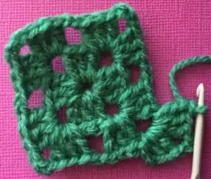 Crochet granny square third row first corner