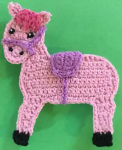 Crochet rocking horse body with saddle