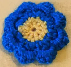 Crochet flower for granny square back of finished flower