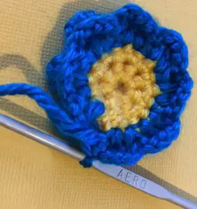 Crochet flower for granny square back of row two