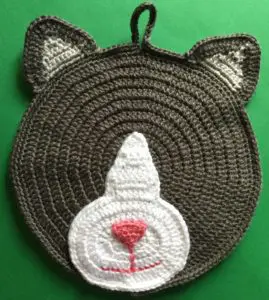 Crochet cat potholder head with face marking