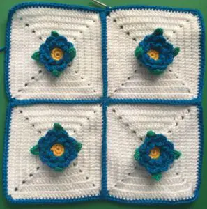 Crochet flower cushion first row finished