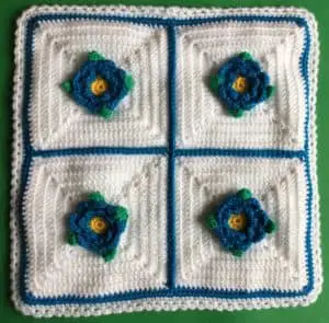 Crochet flower cushion front with cushion top stitched on