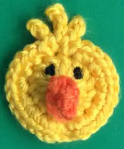 Crochet chicken head with beak and eyes