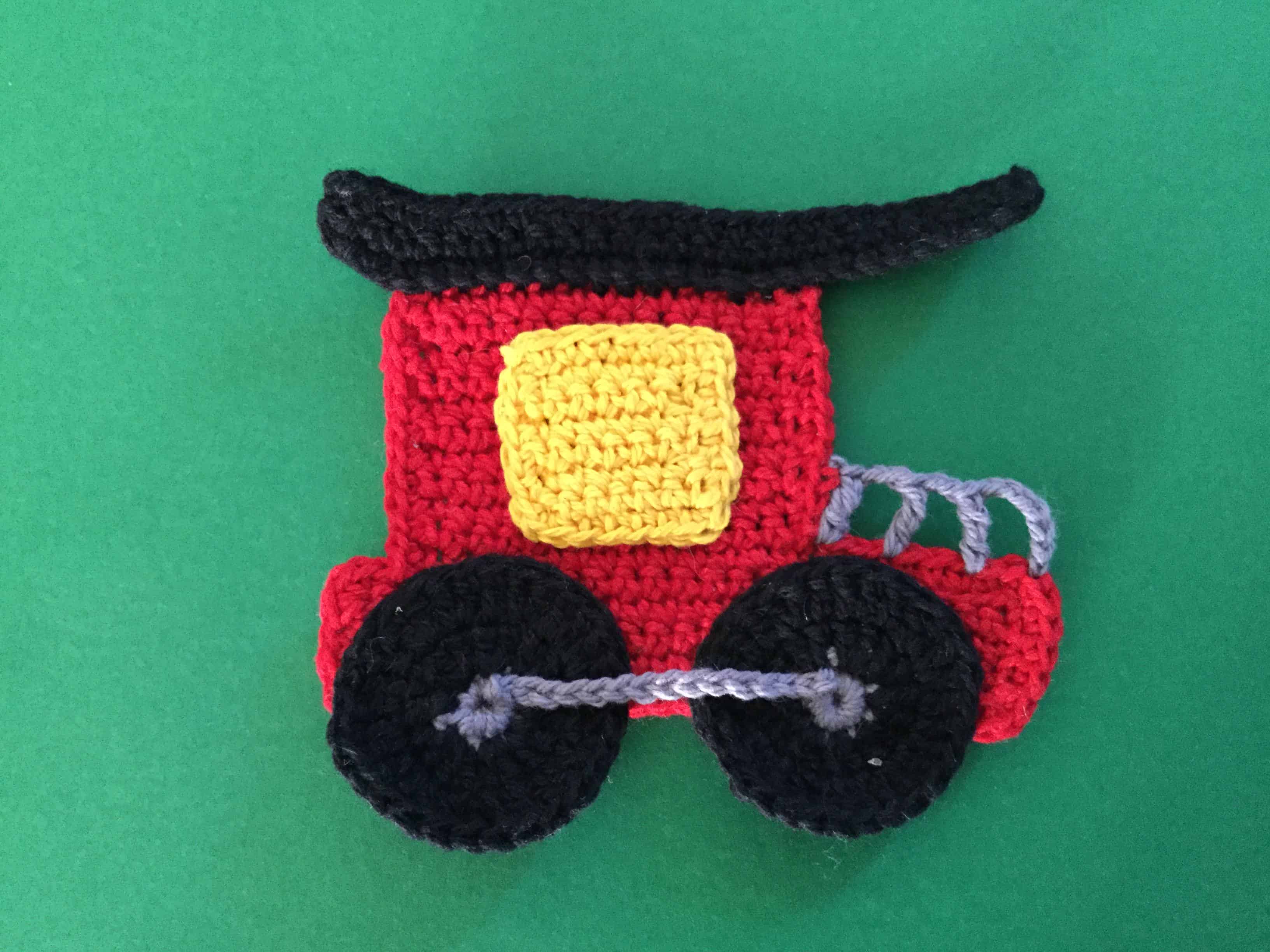 Finished crochet train caboose landscape