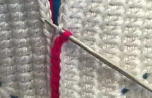 Joining granny square with slip stitch hook in through outer look of first granny square