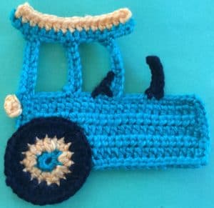 Crochet tractor body with large wheel