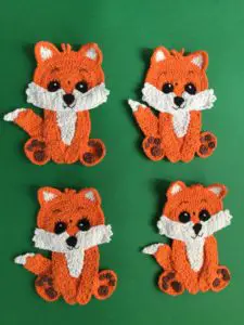 Finished crochet baby fox group portrait