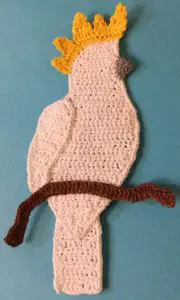 Crochet cockatoo body with branch