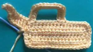 Crochet digger back arm