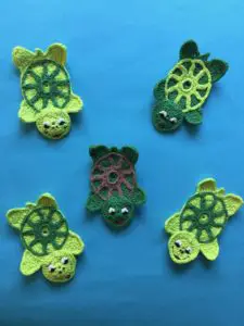 Finished crochet turtle pattern group portrait