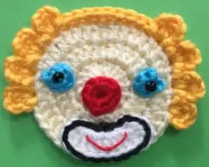 Crochet clown with tophat head with eyes