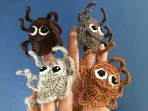 Finished crochet spider finger puppet group landscape