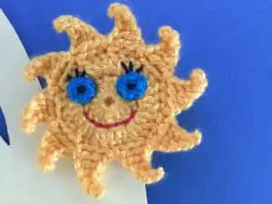 Finished crochet sun finger puppet landscape
