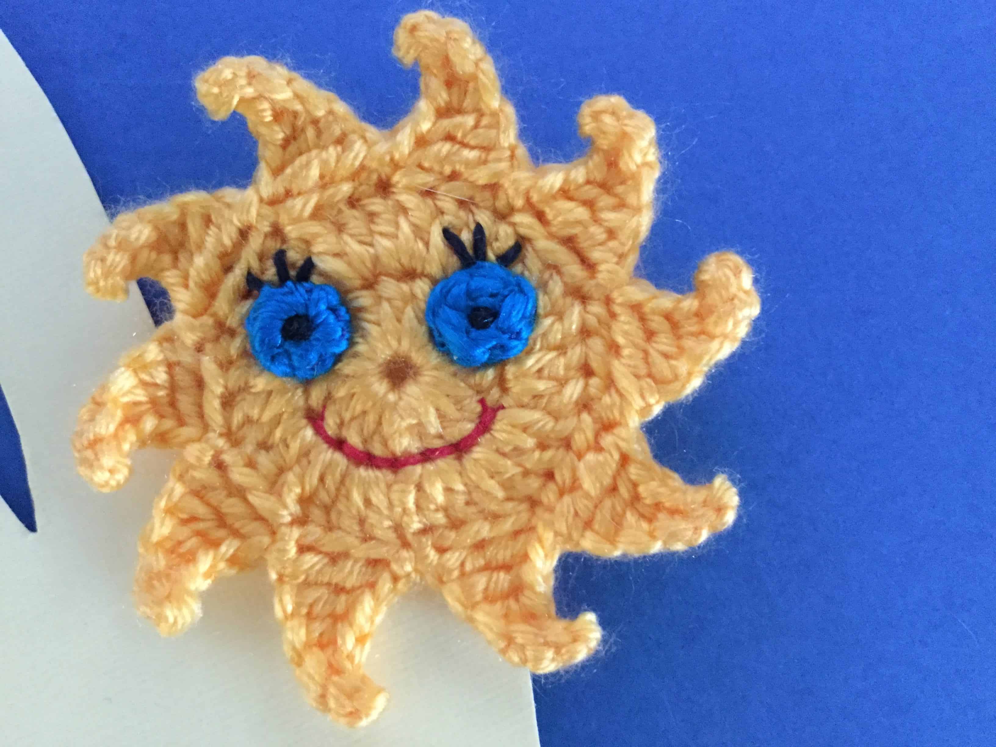 Finished crochet sun finger puppet landscape