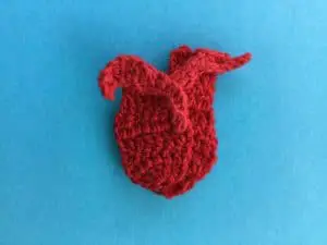 Crochet rosebud tail weaved in behind back petal