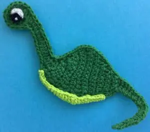 Crochet dinosaur body with eye