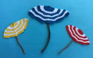 Finished crochet beach umbrella group landscape