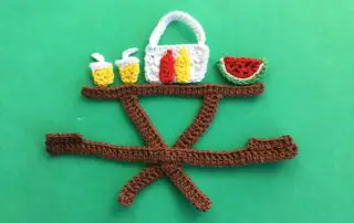 Finished crochet picnic food on table landscape