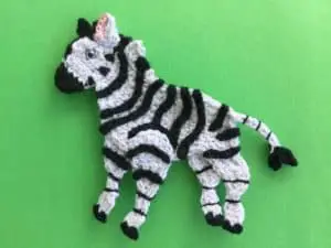 Finished crochet zebra two tail ends landscape