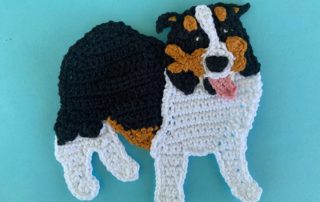 Finished crochet tri colored border collie 4 ply landscape