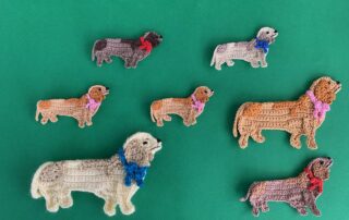 Finished crochet sausage dog 2 ply group landscape
