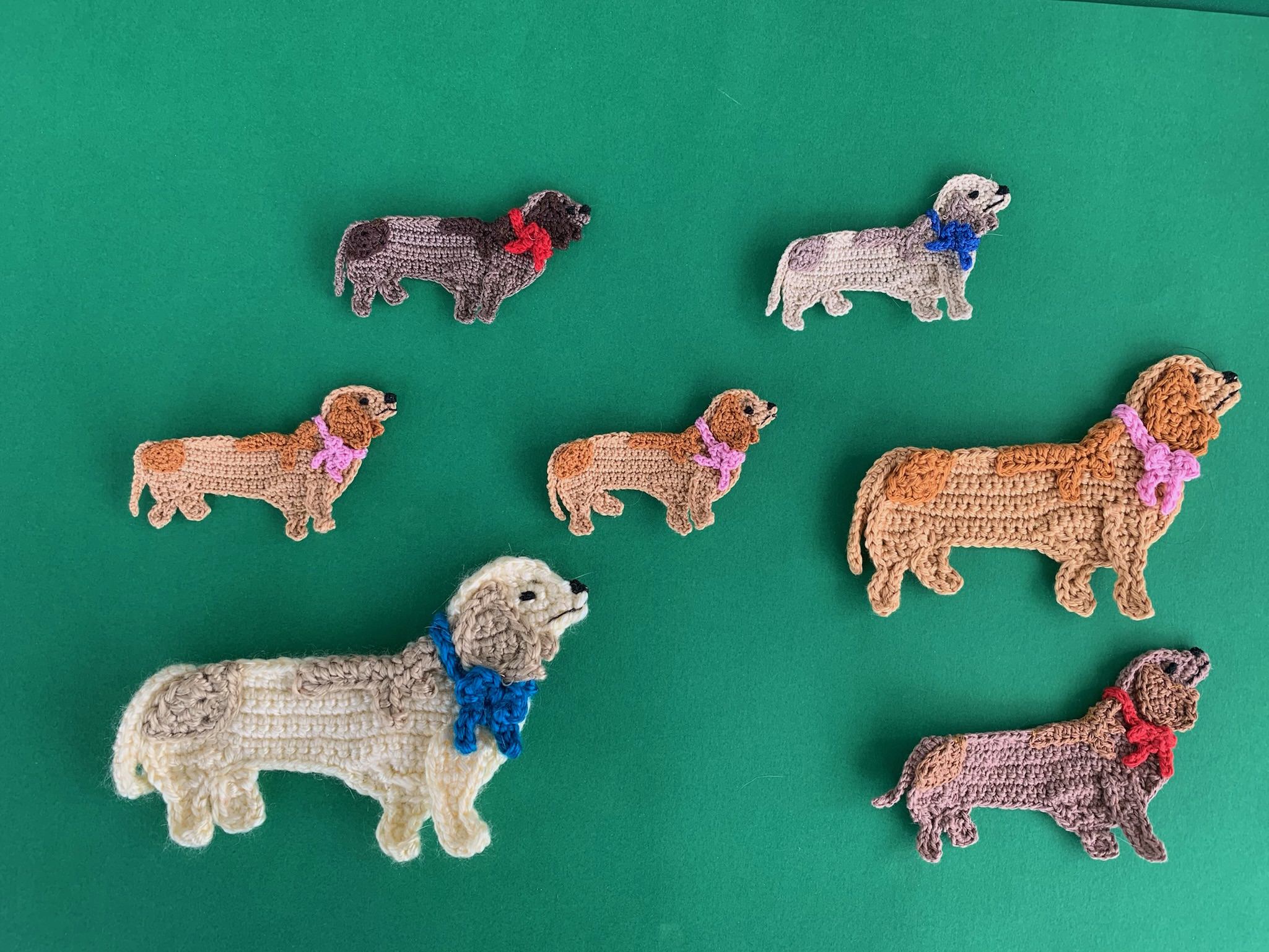 Finished crochet sausage dog 2 ply group landscape