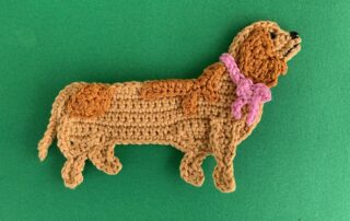 Finished crochet sausage dog 4 ply landscape