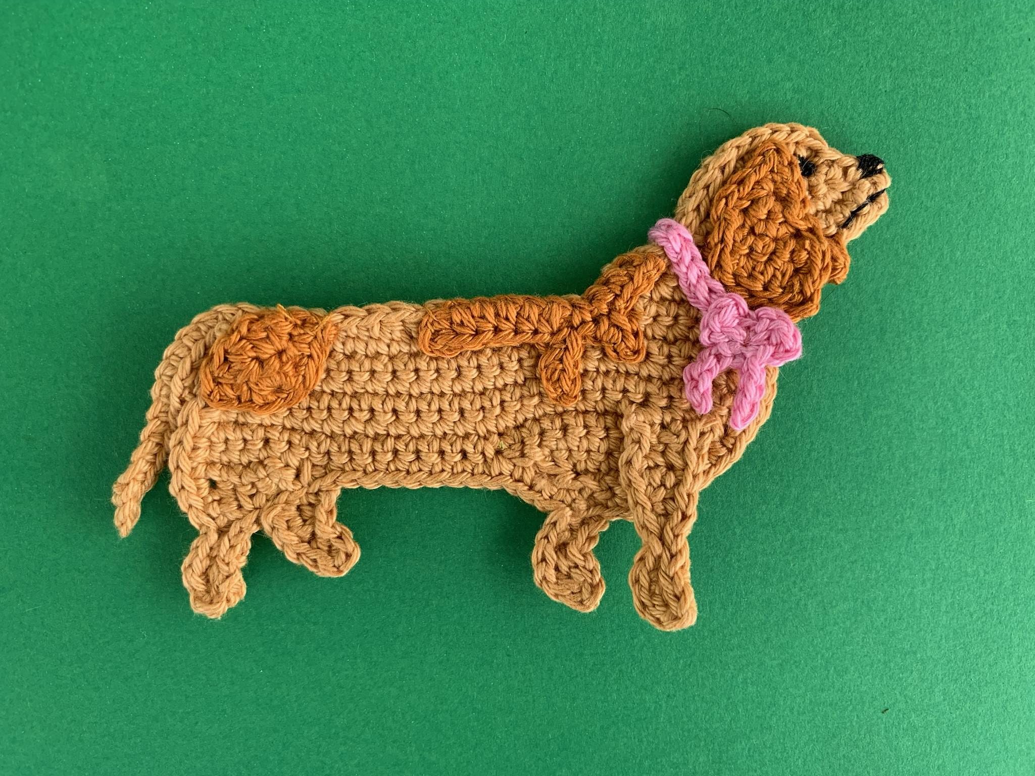 Finished crochet sausage dog 4 ply landscape