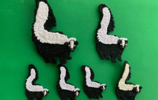 Finished crochet skunk 2 ply group landscape