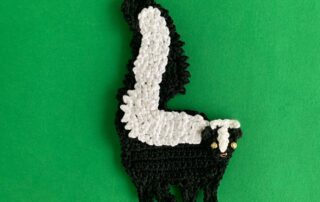 Finished crochet skunk 4 ply landscape