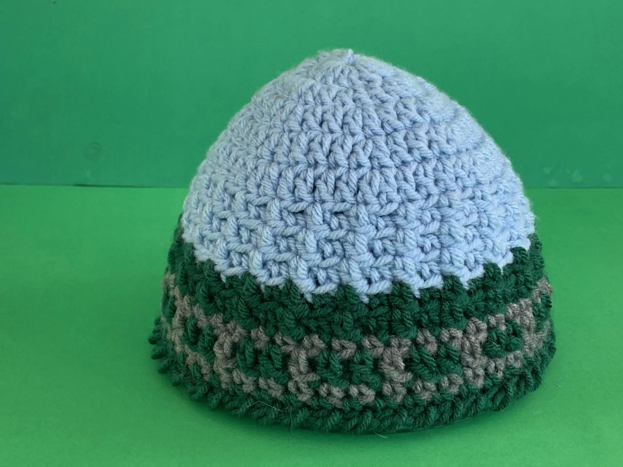 Finished train track beanie green background landscape
