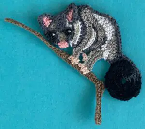 Crochet gumnut 2 ply possum on branch