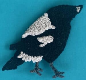 Crochet magpie 2 ply body with near wing marking