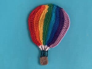 Finished crochet hot air balloon pattern 2 ply light background landscape
