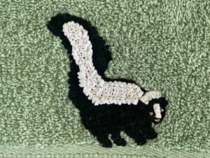 Finished crochet woodland animal towel skunk