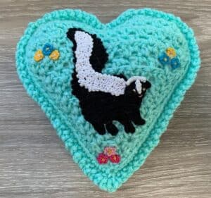 Crochet heart skunk