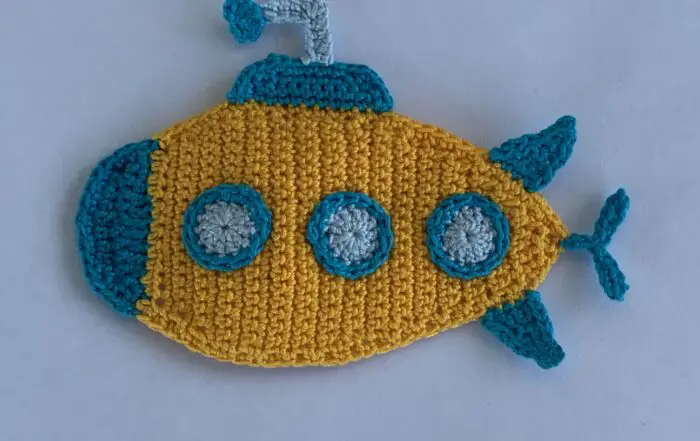 Finished crochet submarine 2 ply landscape white background