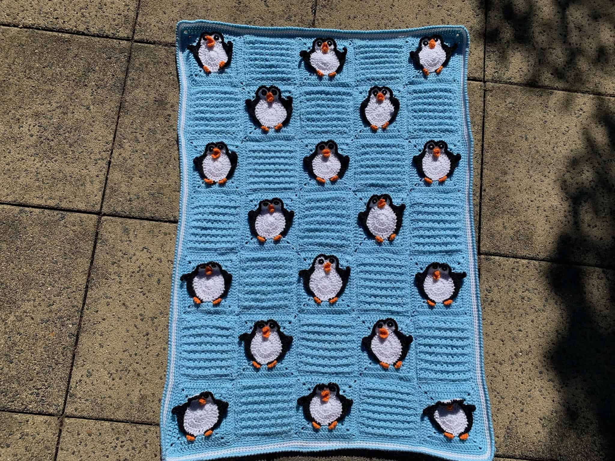 Finished crochet penguin baby blanket landscape