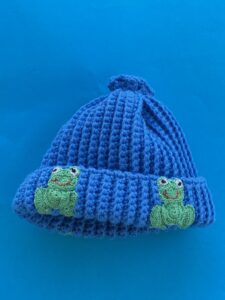 Finished crochet beanie frogs portrait